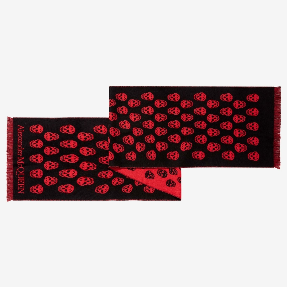 Reversible wool jacquard skull scarf in black and red with fringed edges
